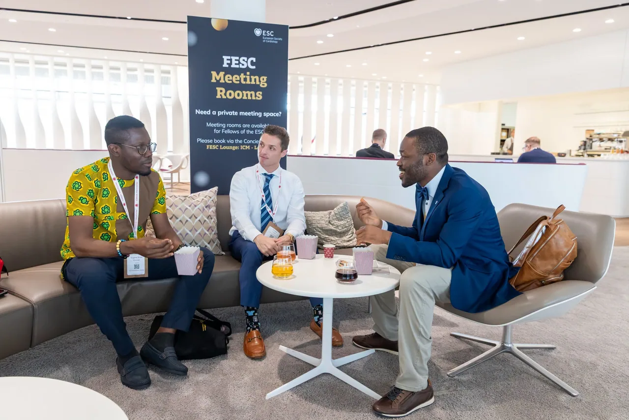 Discussion between Professor Agbaje and his PhD students (Drs Douglas Corsi and Eugene Enimah) at the European Society of Cardiology Congress in Munich, Germany, August 2026