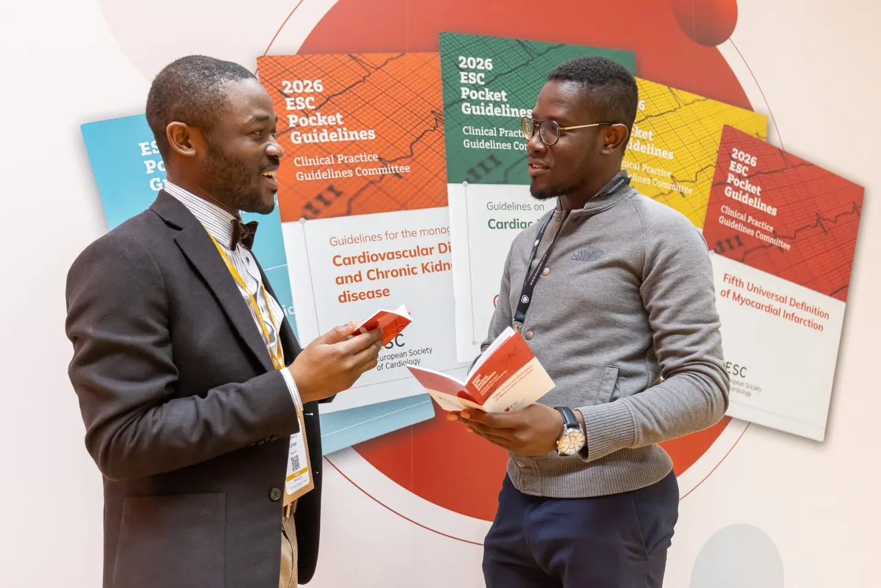 Dr Eugene Enimah and Professor discussing the new clinical guideline at ESC Congress in Munich, Germany, August 2026.